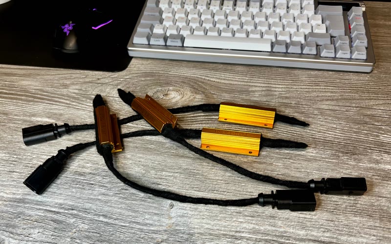 Four gold load resistors in braided wiring with plugs, the finished Magnetic Ride cancellation kit