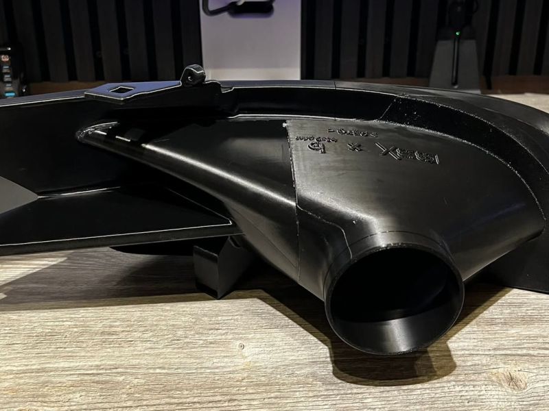 The headlight air intake from behind, with the outlet towards the airbox inlet