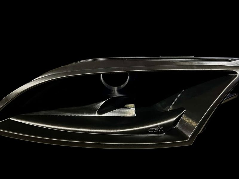 The printed headlight air intake duct with the IBEX logo