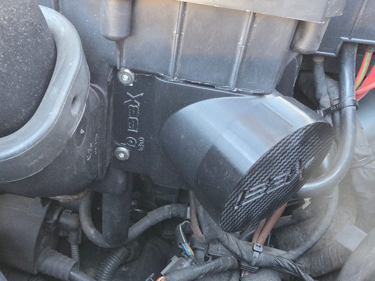 Airbox inlet with the TPU cap and IBEX logo in the engine bay of the Audi TT