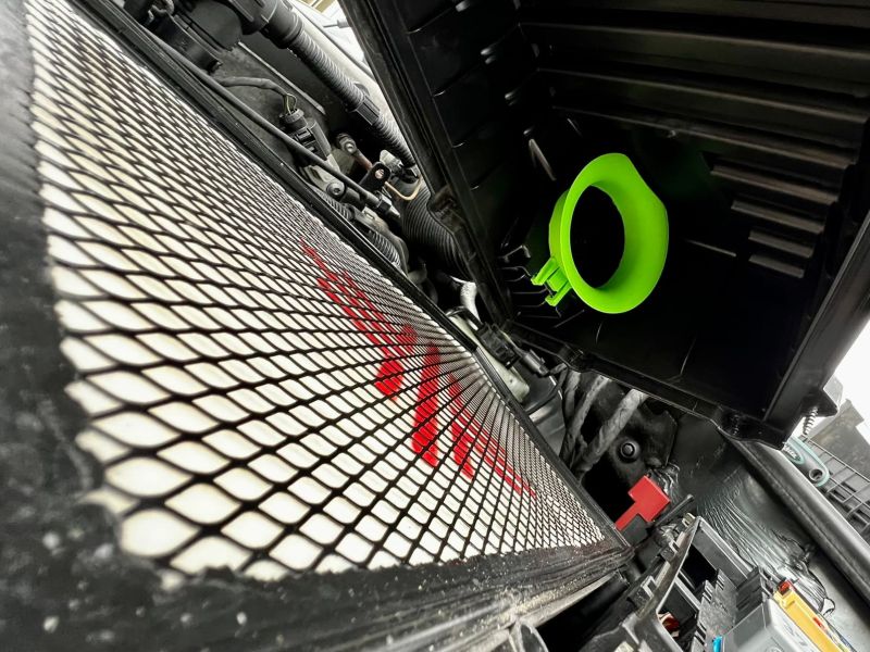 Neon green velocity stack in the opened air filter housing
