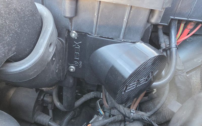 Airbox inlet with the TPU cap and IBEX logo in the engine bay of the Audi TT