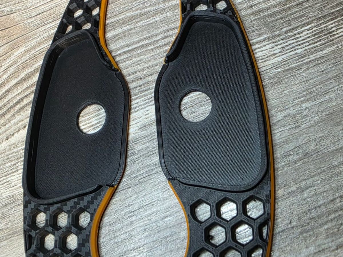 3D-printed honeycomb paddle shifters in black and orange for the KIA ProCeed GT