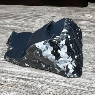 The gunmetal rock that holds the hammer