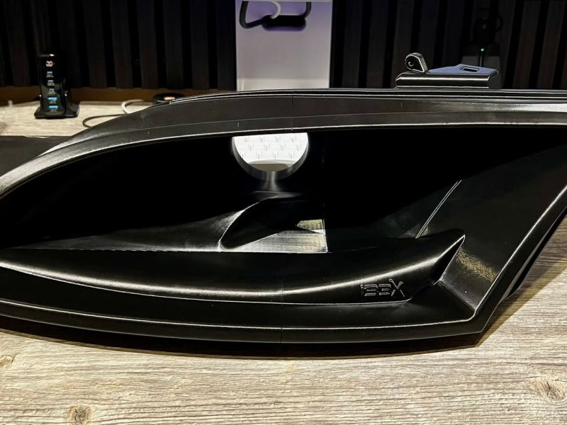 The printed headlight air intake duct from the front, with the IBEX logo
