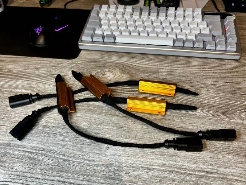 The finished cancellation kit: four resistors in braided wiring, two with plugs for the rear axle