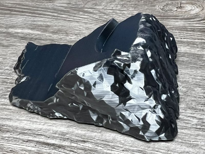 The gunmetal rock that holds the hammer