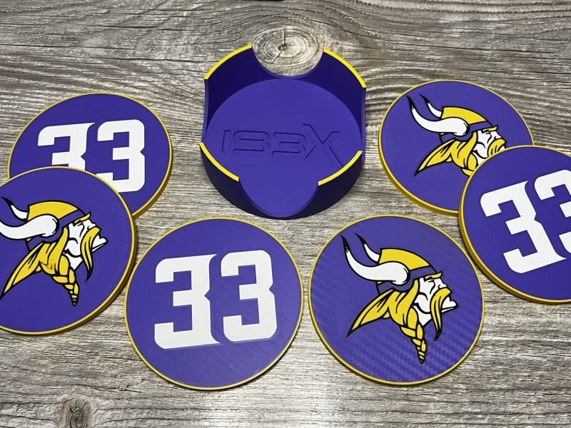 Purple coasters with the Vikings logo and the 33 around their holder