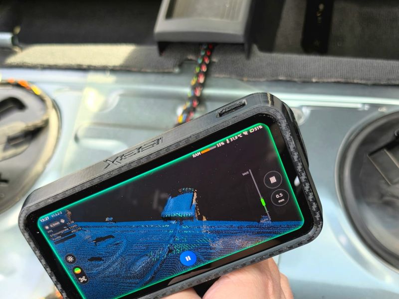 Scanning the floor of the rear footwell