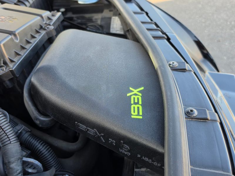 Airbox cover with the green IBEX logo