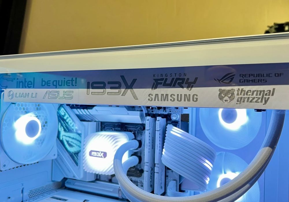 The white radiator cover fitted in the case, brand lettering along its length, lit from inside