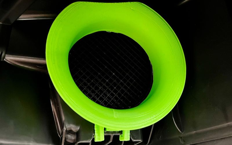 Neon green velocity stack in the inlet of the R32 air filter housing