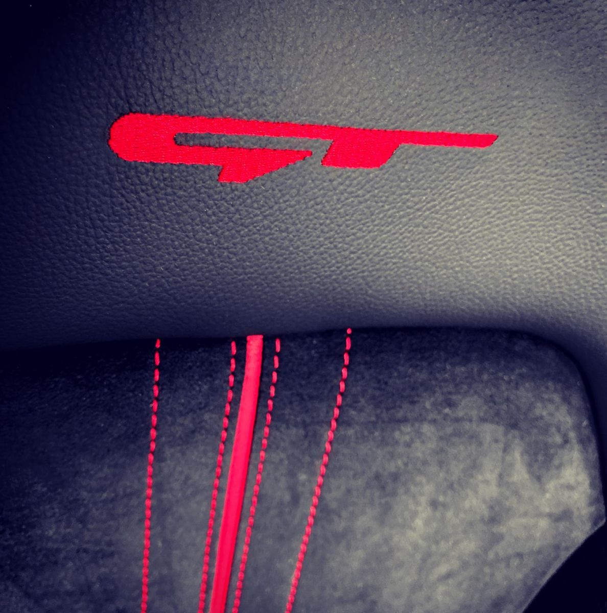 GT logo and red stitching on the sport seat of the KIA ProCeed GT