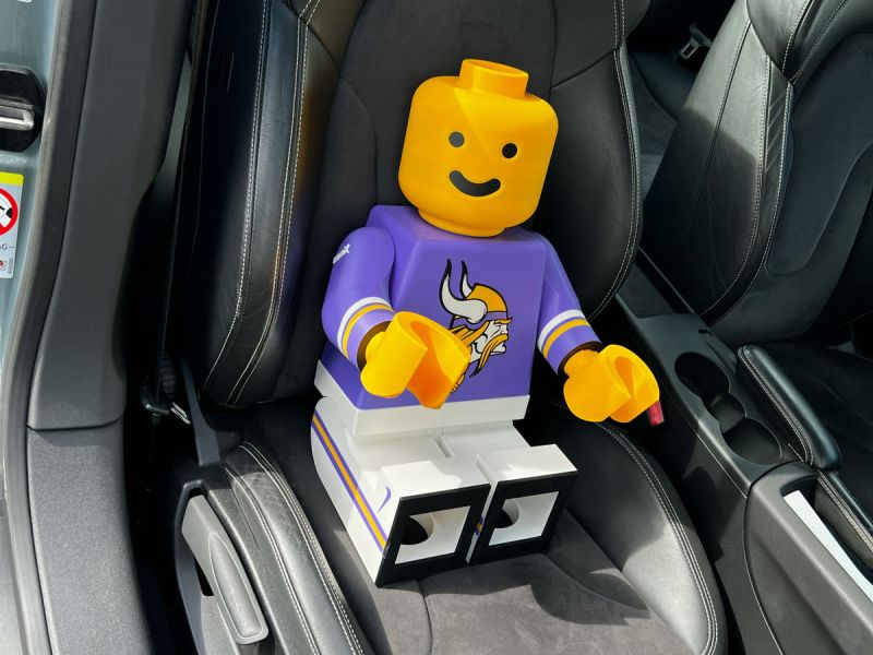 The Brickman sitting in the car on his way to his new home