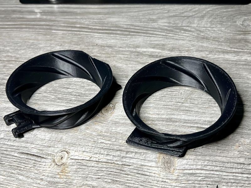 Two velocity stacks with their mounting clips