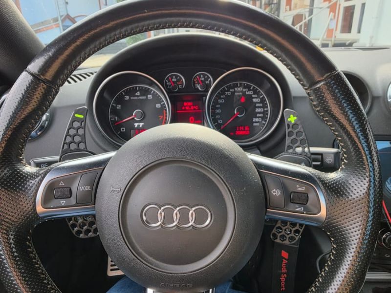 Paddle shifters with the instrument cluster behind