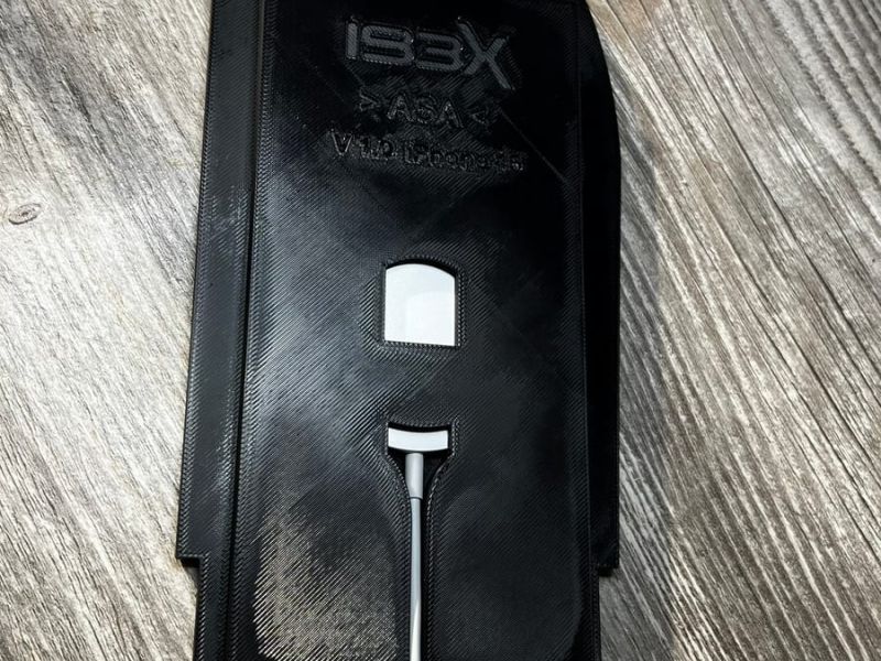 Back of the insert with the IBEX logo and the cable routed through