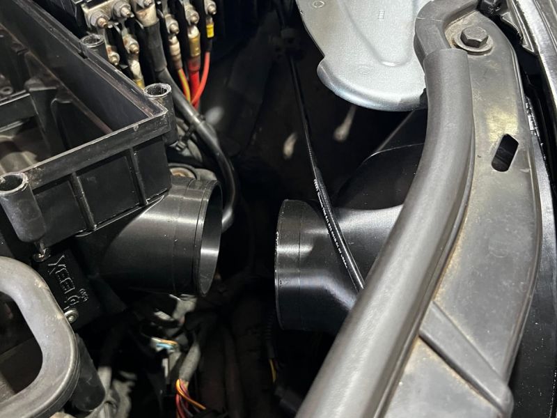 Inlet fitted in the engine bay next to the headlight intake route