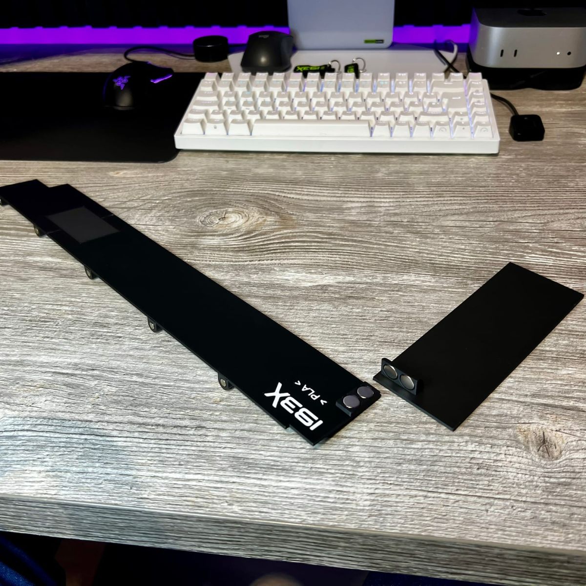 Printed bottom plate parts with the IBEX logo on the desk