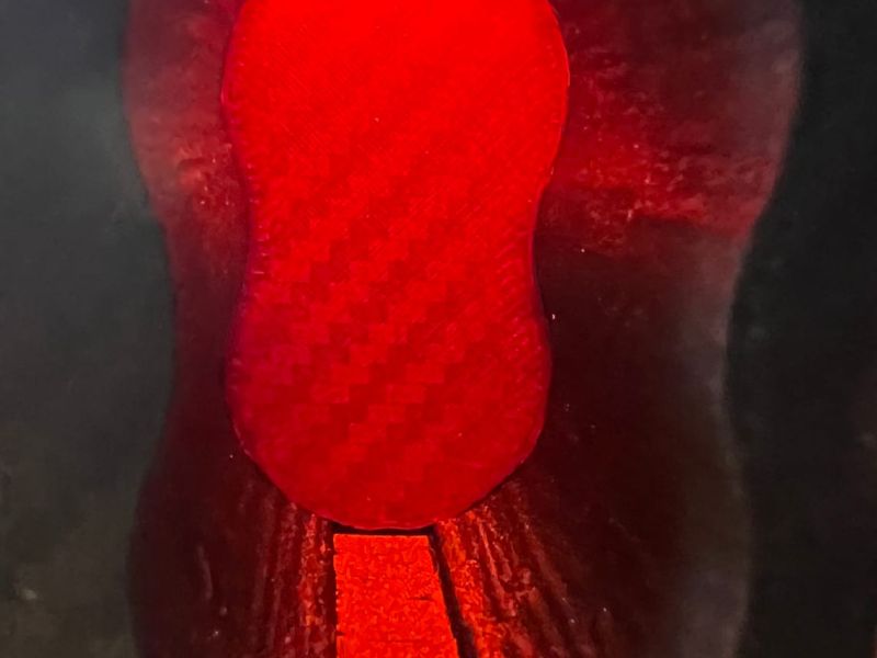 Ashtray lighting glowing red through the TPU at night