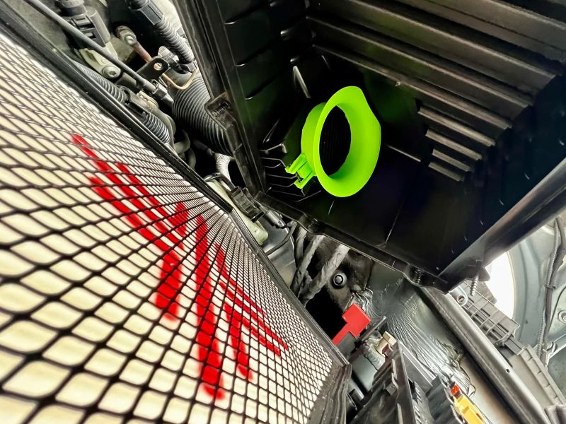 Neon green velocity stack next to the air filter