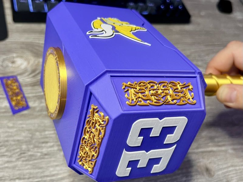 The hammer head with the 33 and gold ornament inserts