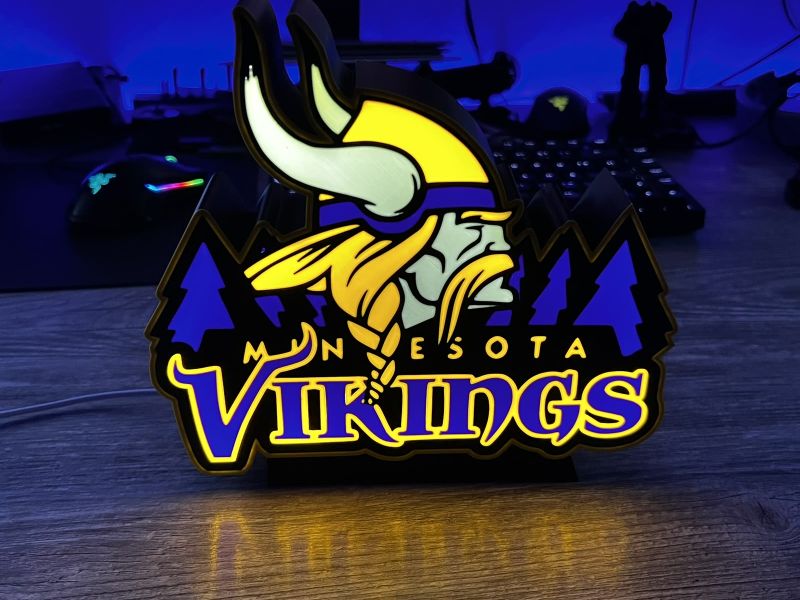 The Minnesota Vikings light box lit up in front of the monitors