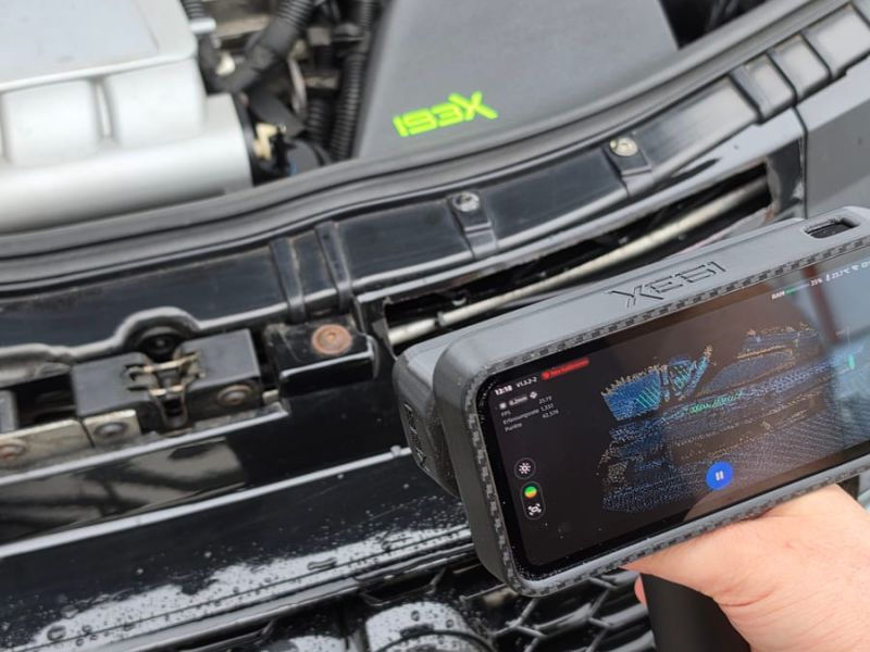 Test fitting with the phone app reading live data at the grille