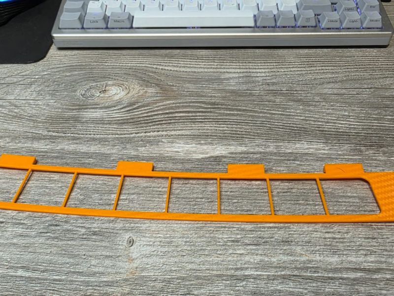 Orange test print of the grille insert frame