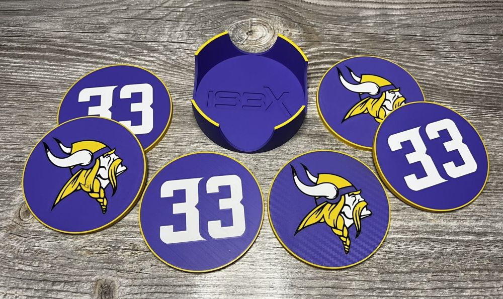 Purple coasters with the Vikings logo and the 33 around their holder